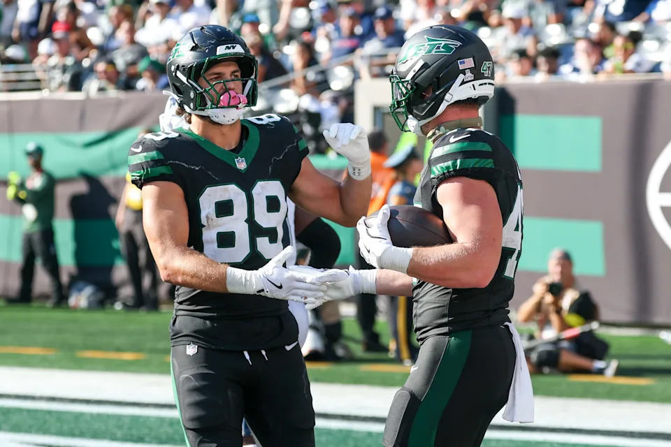 Oct 5, 2025; East Rutherford, New Jersey, USA; New York Jets running back Andrew Beck (47) and tight end Jeremy Ruckert (89) react after a touchdown catch against the Dallas Cowboys during the second half at MetLife Stadium. Mandatory Credit: Vincent Carchietta-Imagn Images