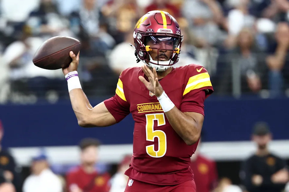 Oct 19, 2025; Arlington, Texas, USA; Washington Commanders quarterback Jayden Daniels (5) passes the ball against the Dallas Cowboys during the first quarter of the game at AT&T Stadium. Mandatory Credit: Kevin Jairaj-Imagn Images© Kevin Jairaj-Imagn Images