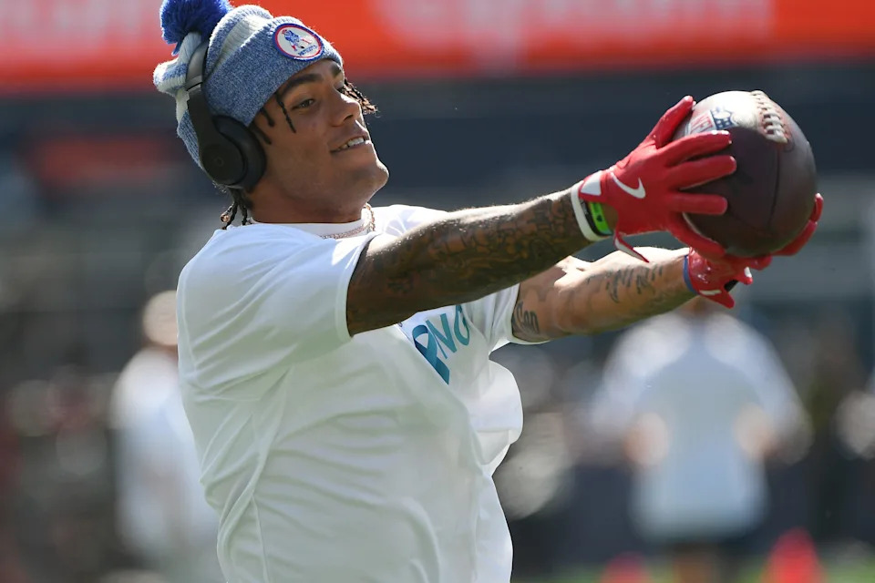 Sep 28, 2025; Foxborough, Massachusetts, USA; New England Patriots cornerback Christian Gonzalez (0) catches the ball during warmups prior to a game against the Carolina Panthers at Gillette Stadium. Mandatory Credit: Bob DeChiara-Imagn Images