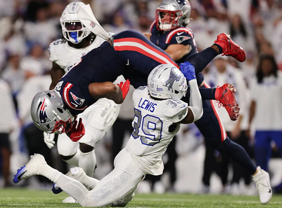 ORCHARD PARK, NEW YORK - OCTOBER 05: Antonio Gibson #4 of the New England Patriots fumbles after being tackled by Cam Lewis #39 of the Buffalo Bills in the second quarter of the game at Highmark Stadium on October 05, 2025 in Orchard Park, New York. (Photo by Bryan M. Bennett/Getty Images)