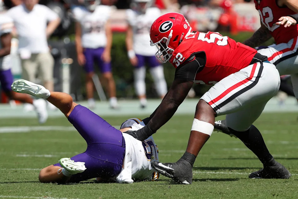 Georgia defensive lineman Christen Miller (52) sacks Tennessee Tech quarterback Jordyn Potts (5) during the first half of a NCAA college football game against Tennessee Tech in Athens, on Saturday, Sept. 7, 2024.