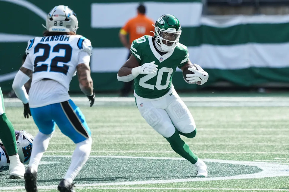 Oct 19, 2025; East Rutherford, New Jersey, USA; New York Jets running back Breece Hall (20) runs with the ball in the first quarter against the Carolina Panthers at MetLife Stadium. Mandatory Credit: Robert Deutsch-Imagn Images