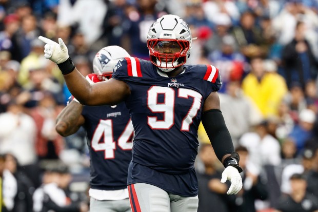New England Patriots defensive tackle Milton Williams signals during an NFL game against the Las Vegas Raiders at Gillette Stadium on Sept. 7. (Winslow Townson/AP Images for Panini)