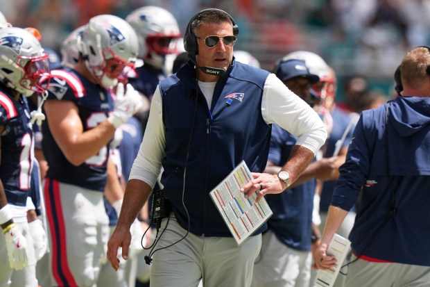 New Englan Patriots head coach Mike Vrabel watches during the half of an NFL football game against the Miami Dolphins Sunday, Sept. 14, 2025, in Miami Gardens, Fla. (AP Photo/Lynne Sladky)