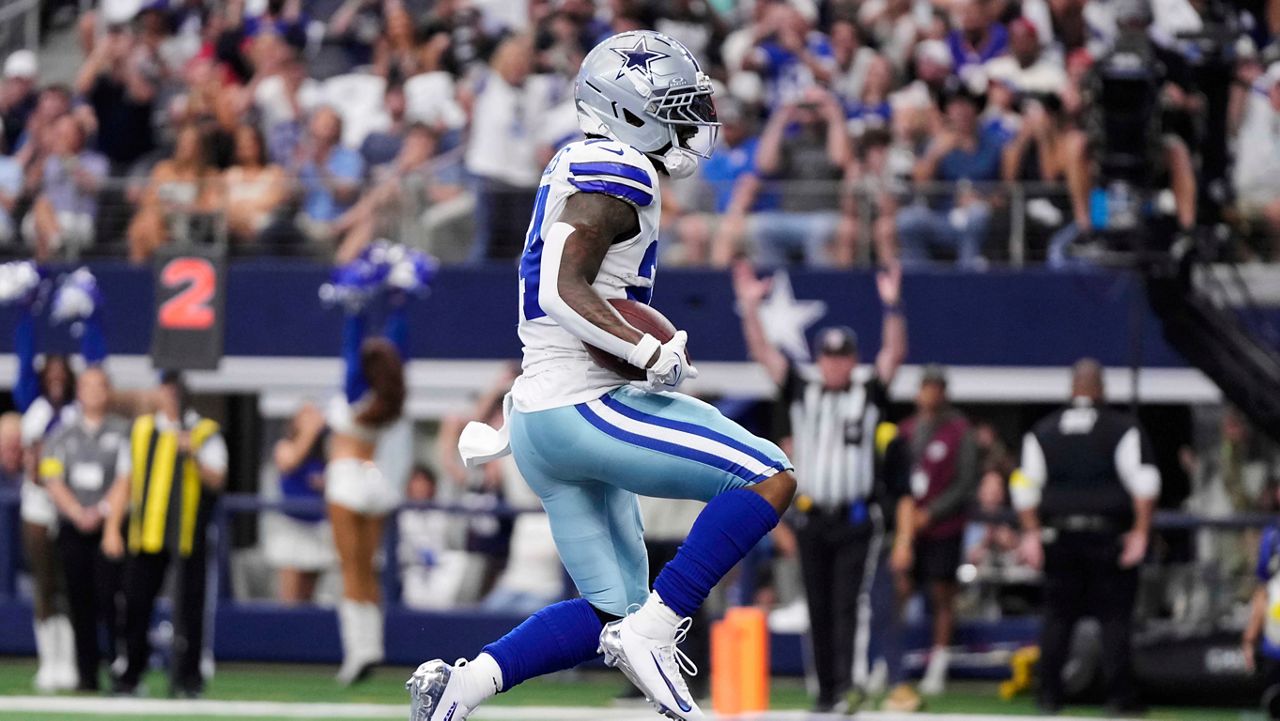 Dallas Cowboys running back Miles Sanders (24) runs the ball for a touchdown in the second half of an NFL football game against the New York Giants Sunday, Sept. 14, 2025, in Arlington, Texas. (AP Photo/Jeffrey McWhorter)