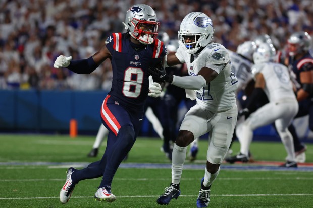 New England Patriots wide receiver Stefon Diggs (8) is chased by Buffalo Bills cornerback Tre'Davious White during the first half of an NFL game in Orchard Park, N.Y., last Sunday. (AP Photo/ Jeffrey T. Barnes)