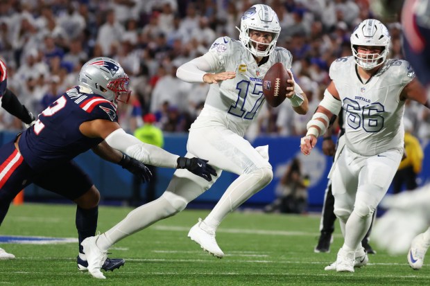 Buffalo Bills quarterback Josh Allen (17) carries the ball during the second half of an NFL football game against the New England Patriots in Orchard Park, N.Y., Sunday Oct. 5, 2025. (AP Photo/ Jeffrey T. Barnes)