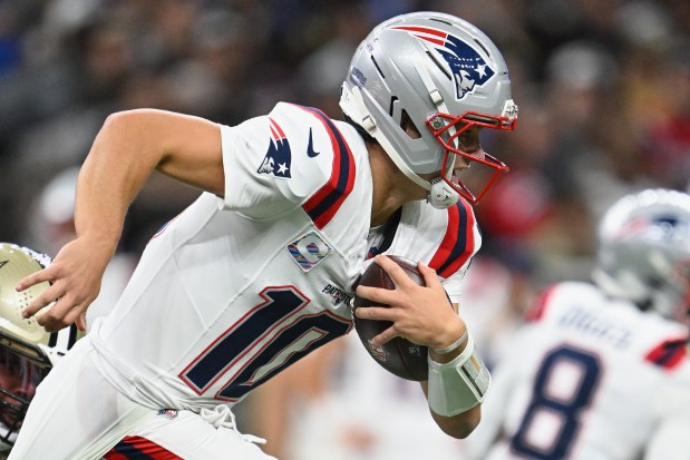 New England Patriots quarterback Drake Maye runs during the first half of an NFL football game against the New Orleans Saints, Sunday, Oct. 12, 2025, in New Orleans. (AP Photo/Ella Hall)