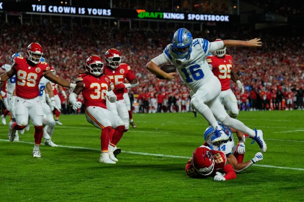 Detroit Lions quarterback Jared Goff (16) runs into the end zone over Kansas City Chiefs cornerback Trent McDuffie (22) on a play that was nullified after Goff was called for illegal motioin on the play during the first half of an NFL football game Sunday, Oct. 12, 2025, in Kansas City, Mo. (AP Photo/Charlie Riedel)