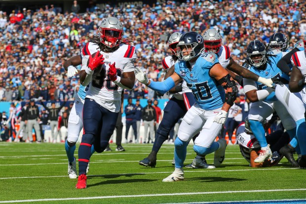 New England Patriots running back Rhamondre Stevenson (38) runs for a touchdown during the second half of an NFL football game against the Tennessee Titans, Sunday, Oct. 19, 2025, in Nashville, Tenn. (AP Photo/Stew Milne)