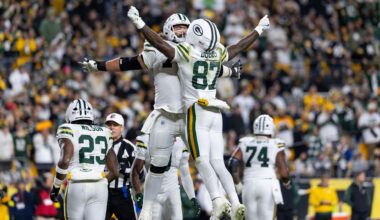 Green Bay Packers wide receiver Romeo Doubs (87) celebrates with guard Sean Rhyan (75) during an NFL football game, Sunday, Oct. 26, 2025, in Pittsburgh. (AP Photo/Matt Durisko)