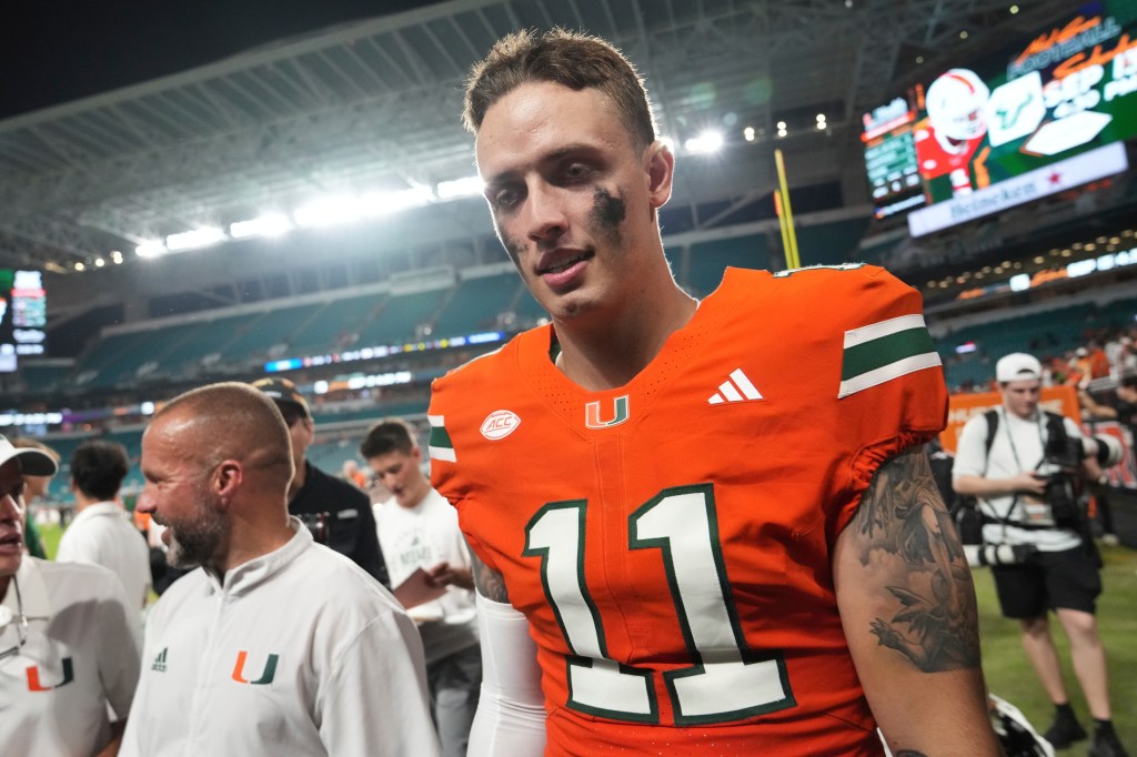 Miami quarterback Carson Beck (11) walks off the field after defeating Bethune-Cookman in an NCAA college football game, Saturday, Sept. 6, 2025, in Miami Gardens, Fla. 