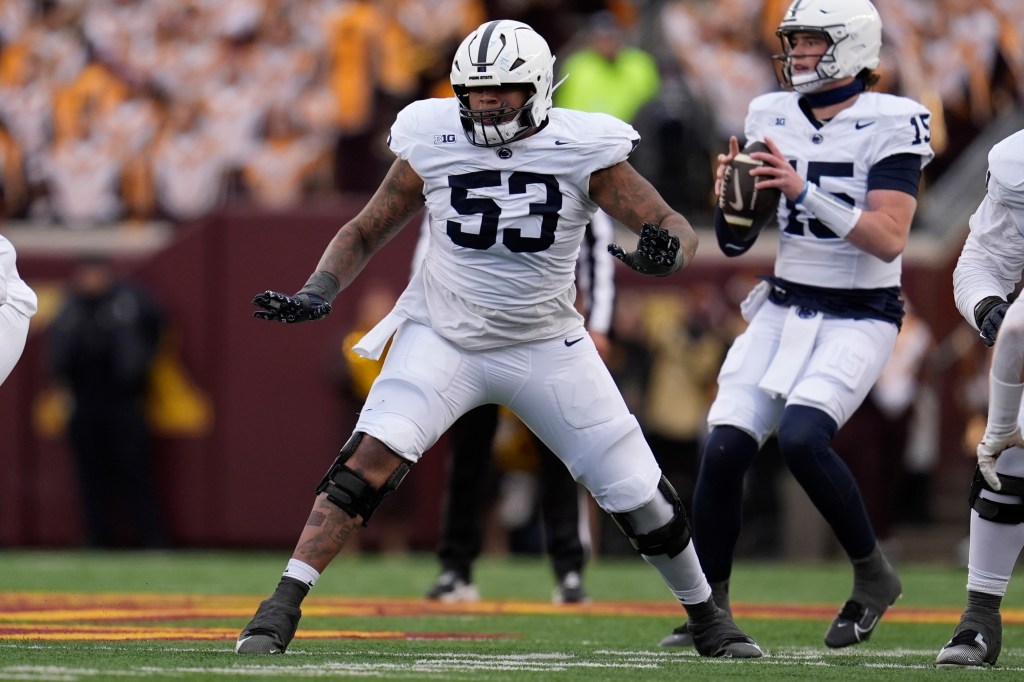 Penn State offensive lineman Nick Dawkins (53) in action during the first half of an NCAA college football game against Minnesota, Nov. 23, 2024, in Minneapolis. 
