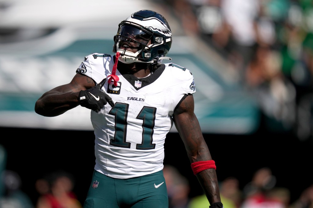Philadelphia Eagles wide receiver A.J. Brown (11) celebrates after scoring during the second half of an NFL football game against the Los Angeles Rams Sunday, Sept. 21, 2025, in Philadelphia. 