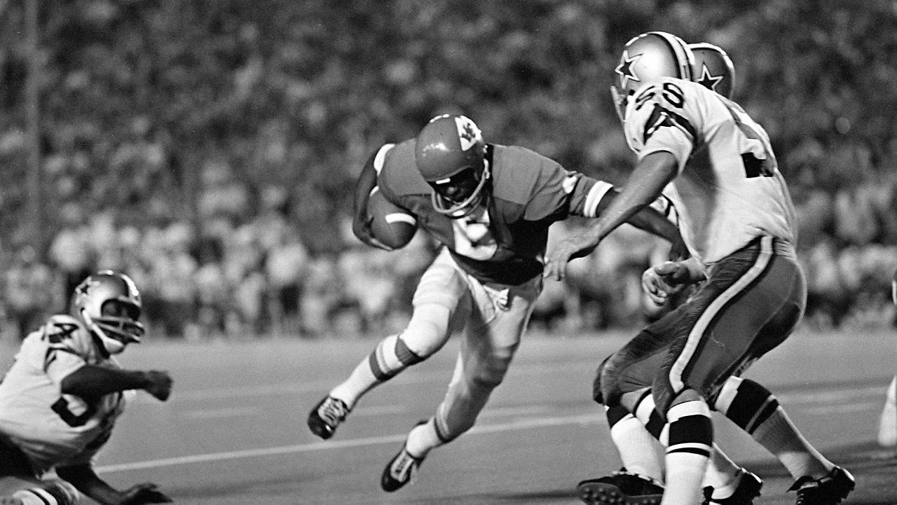 Warren McVea (6) Kansas City Chiefs running back is stopped on an end run by Dallas Cowboy Leroy Jordan (55) in the first quarter action in Dallas, Sept. 5, 1970. (AP Photo/Fred Kaufman)