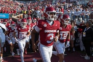 Oklahoma quarterback Michael Hawkins Jr. (3) runs out to the field for warm ups before an...