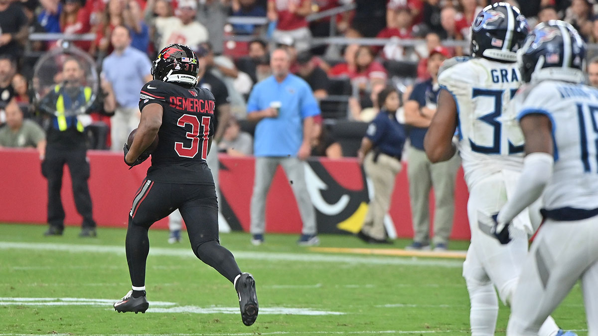 Arizona Cardinals running back Emari Demercado (31) runs the ball for 71 yards before fumbling against the Tennessee Titans during the fourth quarter at State Farm Stadium.