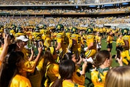 Baylor players run onto to the field prior to the first half of an NCAA college football...