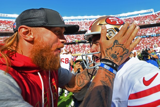 San Francisco 49ers George Kittle (85) congratulates kicker Eddy Pineiro (18) after defeating the Arizona Cardinals during their NFL game at Levi's Stadium in Santa Clara, Calif., on Sunday, Sept. 21, 2025. San Francisco 49ers defeated the Arizona Cardinals 16-15. (Jose Carlos Fajardo/Bay Area News Group)