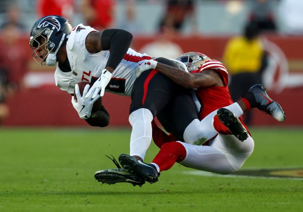 San Francisco 49ers' Renardo Green (0) tackles Atlanta Falcons' Kyle Pitts Sr. (8) after a catch in the first quarter at Levi's Stadium in Santa Clara, Calif., on Sunday, Oct. 19, 2025. (Nhat V. Meyer/Bay Area News Group)