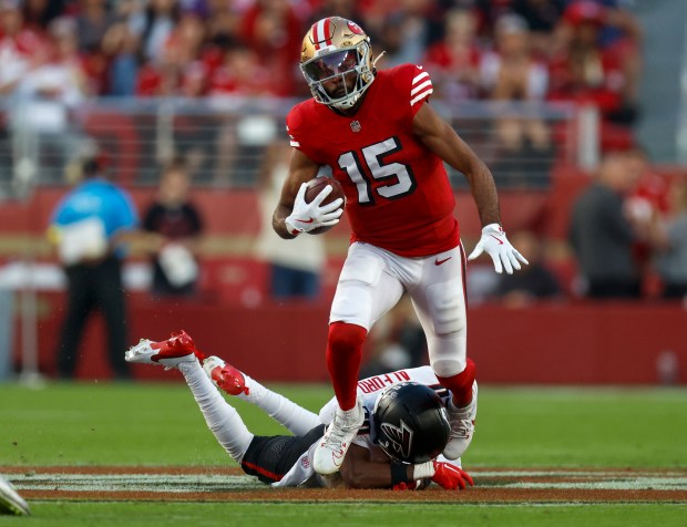 San Francisco 49ers' Jauan Jennings (15) runs after a catch against Atlanta Falcons' Dee Alford (20) in the second quarter at Levi's Stadium in Santa Clara, Calif., on Sunday, Oct. 19, 2025. (Nhat V. Meyer/Bay Area News Group)