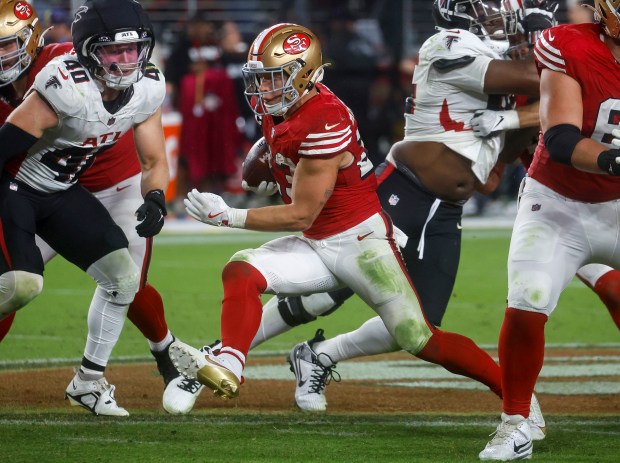 San Francisco 49ers' Christian McCaffrey (23) runs against the Atlanta Falcons in the fourth quarter at Levi's Stadium in Santa Clara, Calif., on Sunday, Oct. 19, 2025. (Nhat V. Meyer/Bay Area News Group)