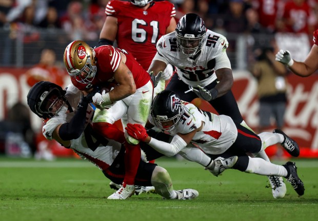 San Francisco 49ers' Christian McCaffrey (23) runs against the Atlanta Falcons defense in the fourth quarter at Levi's Stadium in Santa Clara, Calif., on Sunday, Oct. 19, 2025. (Nhat V. Meyer/Bay Area News Group)