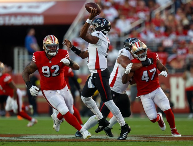 San Francisco 49ers' Jordan Elliott (92) pressures Atlanta Falcons starting quarterback Michael Penix Jr. (9) in the first quarter at Levi's Stadium in Santa Clara, Calif., on Sunday, Oct. 19, 2025. (Nhat V. Meyer/Bay Area News Group)