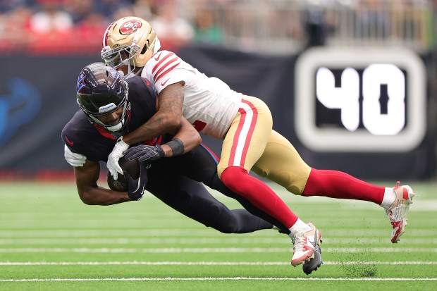 Deommodore Lenoir #2 of the San Francisco 49ers tackles Jared Wayne #89 of the Houston Texans in the first quarter of the game at NRG Stadium on Oct. 26, 2025 in Houston, Texas. (Photo by Alex Slitz/Getty Images)