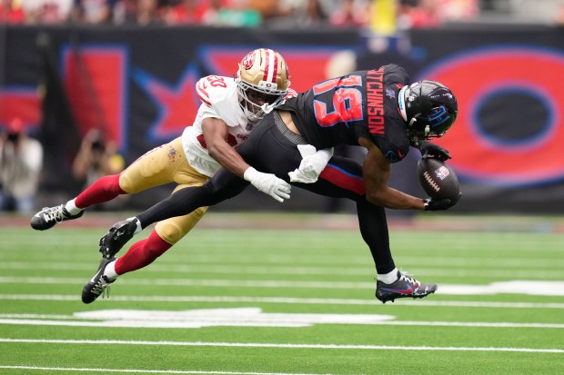 Houston Texans wide receiver Xavier Hutchinson (19) catches a pass as San Francisco 49ers cornerback Upton Stout (20) defends during the first half of an NFL football game Sunday, Oct. 26, 2025, in Houston. (AP Photo/Eric Christian Smith)