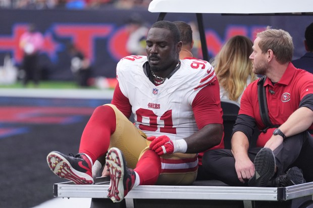 San Francisco 49ers defensive lineman Sam Okuayinonu (91) is taken off on a cart during the second half of an NFL football game against the Houston Texans Sunday, Oct. 26, 2025, in Houston. (AP Photo/Eric Gay)