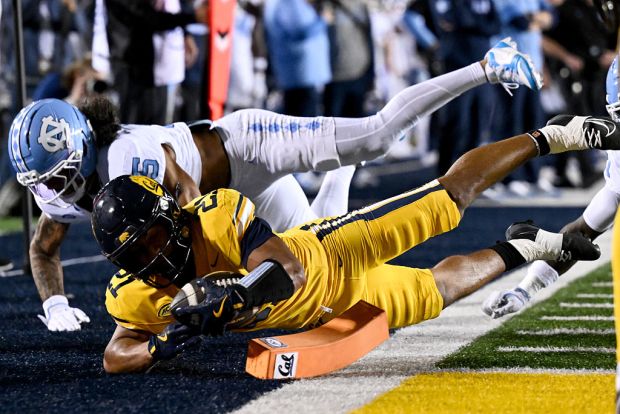 Jacob De Jesus #21 of the California Golden Bears scores a touchdown during the first half against the North Carolina Tar Heels at California Memorial Stadium on Oct. 17, 2025 in Berkeley, California. (Photo by Thien-An Truong/Getty Images)
