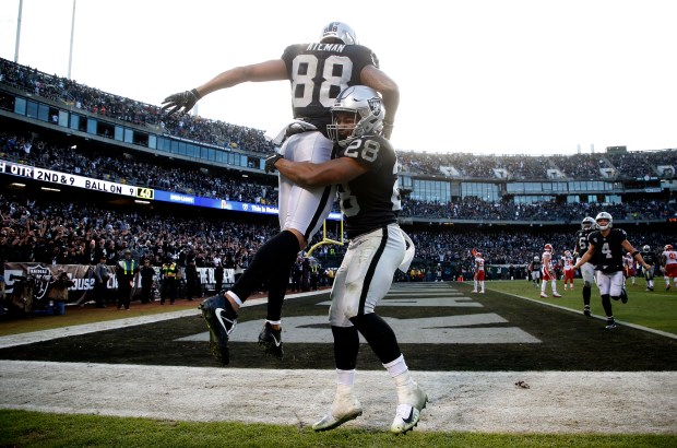 OAKLAND, CA - DECEMBER 2: Oakland Raiders wide receiver Marcell Ateman (88) celebrates his touchdown with teammate Doug Martin (28) during the fourth quarter of their game against the Kansas City Chiefs on Sunday, Dec. 2, 2018, in Oakland, Calif. (Aric Crabb/Bay Area News Group)