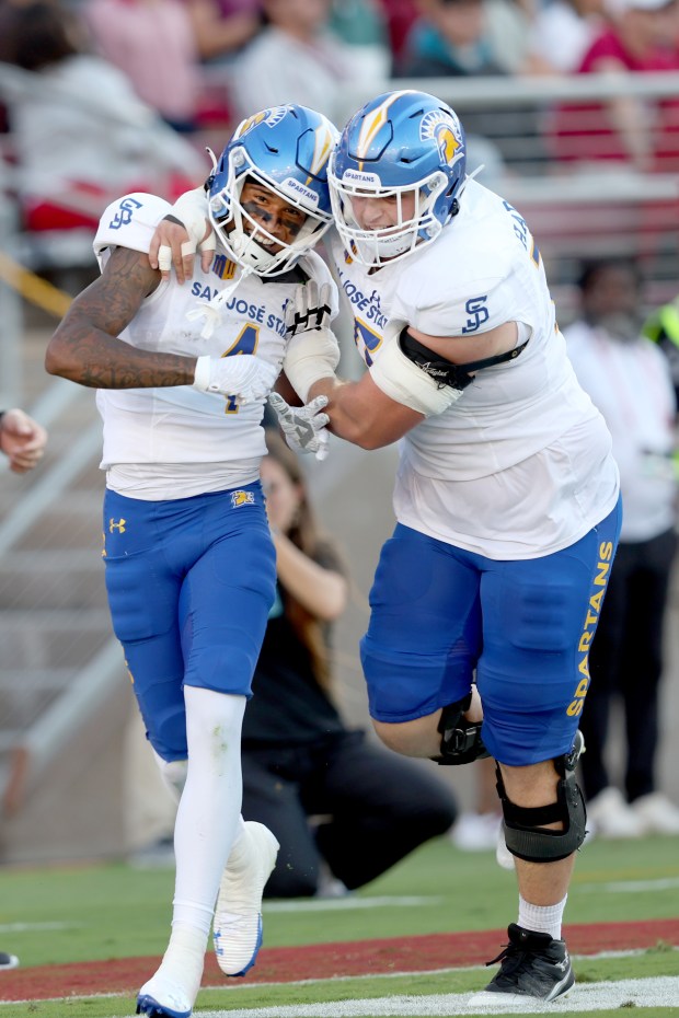 San Jose State Spartans' Kyri Shoels (4) celebrates his touchdown with a teammate afteer scoring against the Stanford Cardinal in the first half of a football game at Statanford Stadium in Stanford, Calif., on Saturday, Sept. 27, 2024. (Ray Chavez/Bay Area News Group)