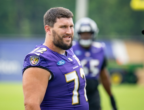 Thursday, July 31, 2025 — Baltimore Ravens guard Andrew Vorhees walks out onto the field for practice during Ravens training camp.