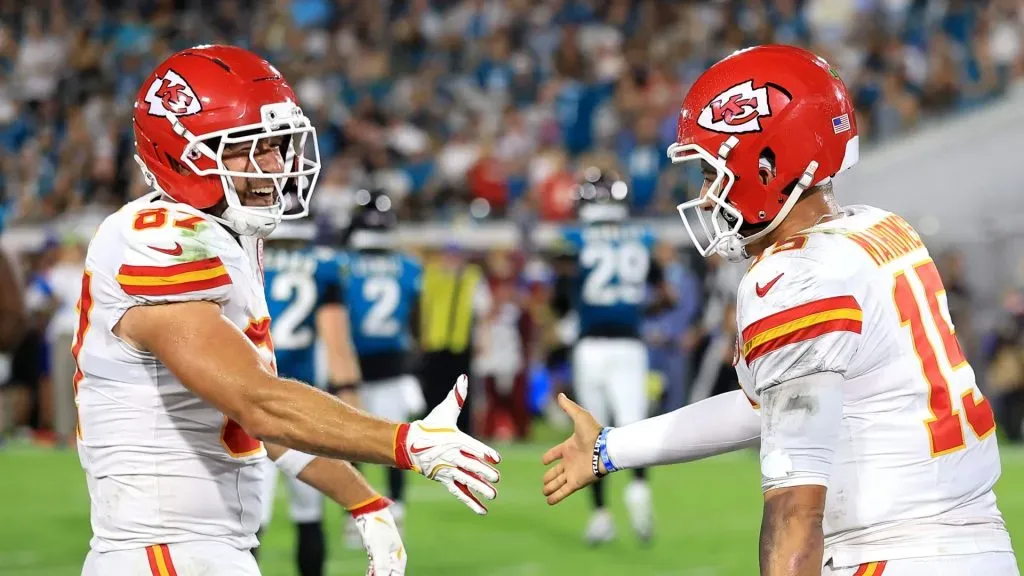 Travis Kelce celebrating a touchdown with Patrick Mahomes.