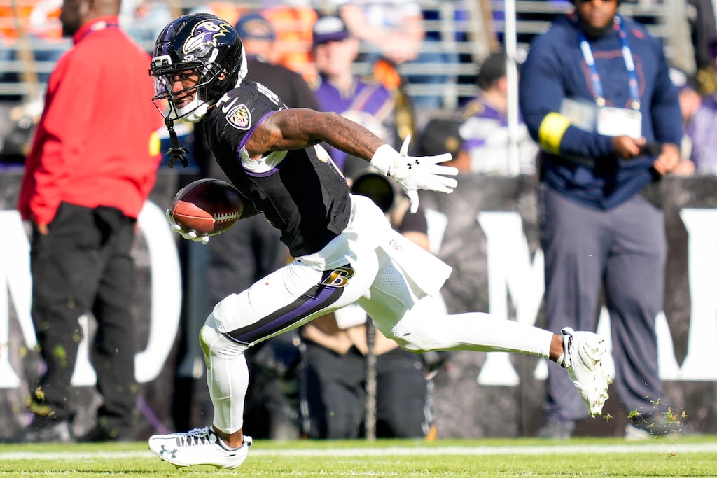 Baltimore Ravens wide receiver Zay Flowers (4) catches a pass and runs with it in the fourth quarter of a game against the Chicago Bears at M&T Bank Stadium in Baltimore, Md., on Sunday, Oct. 26, 2025.