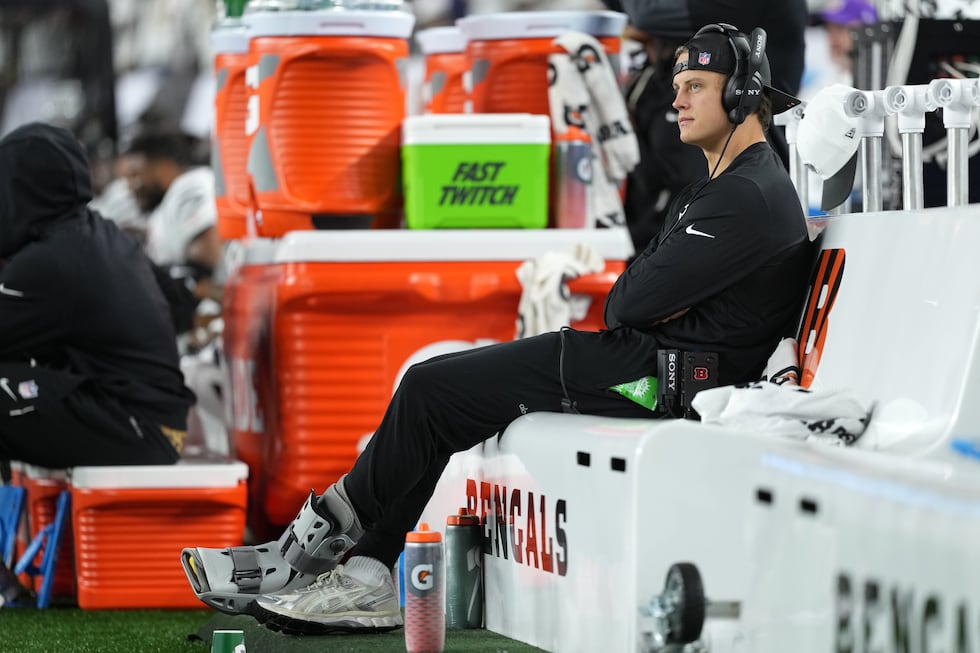 Cincinnati Bengals quarterback Joe Burrow (9) sits on the bench during the first half of an...