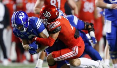 Smith Snowden #2 of the Utah Utes tackles Chase Roberts #2 BYU football...