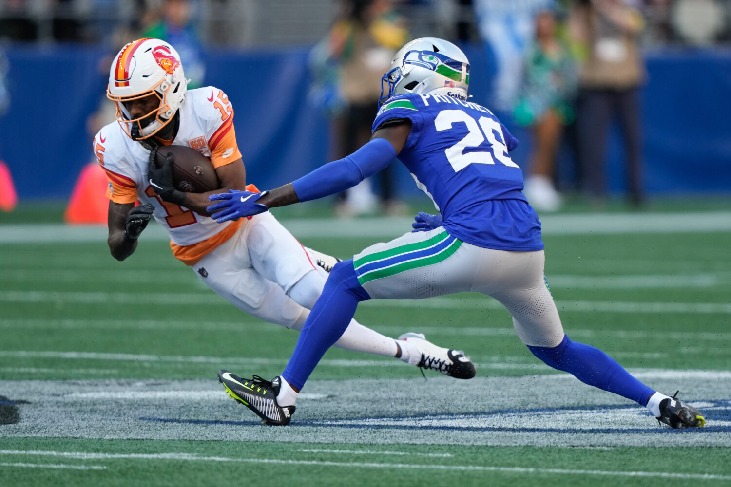 Tampa Bay Buccaneers wide receiver Tez Johnson (15) runs after making a catch as Seattle Seahawks c...