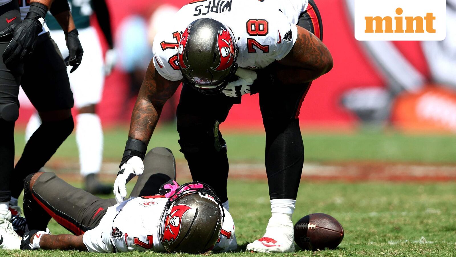 Bucky Irving #7 of the Tampa Bay Buccaneers lays on the field after being injured against the Philadelphia Eagles during the second quarter in the game at Raymond James Stadium.
