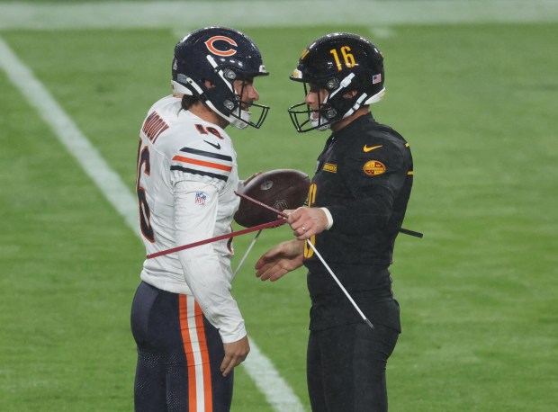 Bears kicker Jake Moody is greeted by Commanders kicker Matt Gay during warmups at Northwest Stadium Oct. 13, 2025, in Landover, Maryland. (John J. Kim/Chicago Tribune)