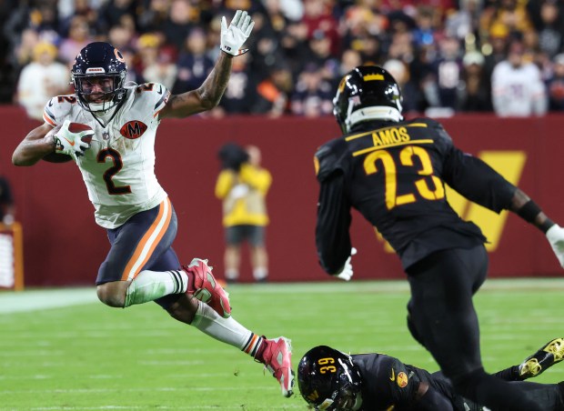 Bears wide receiver DJ Moore (2) escapes the Commanders defense...