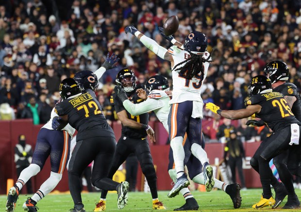 Bears middle linebacker Tremaine Edmunds (49) deflects a pass from...