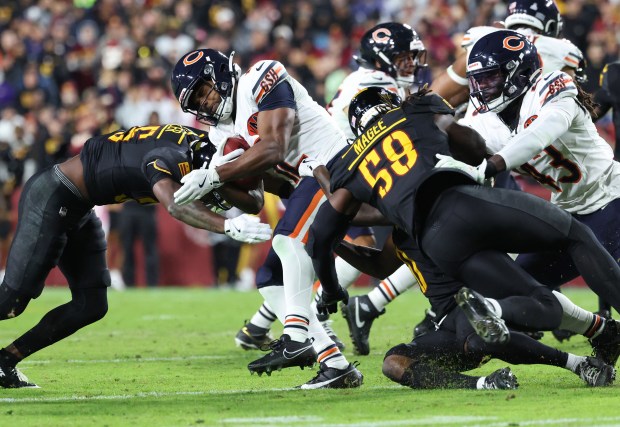 Bears wide receiver Devin Duvernay is tackled on a kickoff...