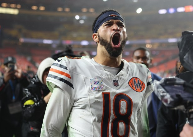 Bears quarterback Caleb Williams celebrates a 25-24 win over the...