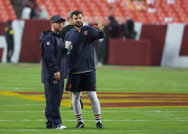 Chicago Bears kickers Cairo Santos, left, and Jake Moody prepare for the game against the Washington Commanders on Oct. 13, 2025, at Northwest Stadium in Landover, Maryland. (Brian Cassella/Chicago Tribune)