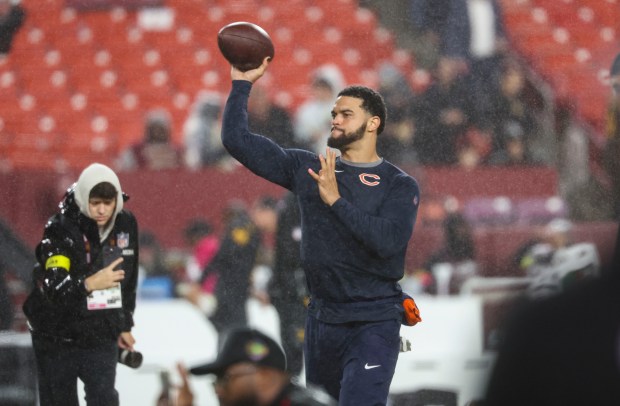 Chicago Bears quarterback Caleb Williams warms up to face the Washington Commanders in the rain Oct. 13, 2025, at Northwest Stadium in Landover, Maryland. (Brian Cassella/Chicago Tribune)