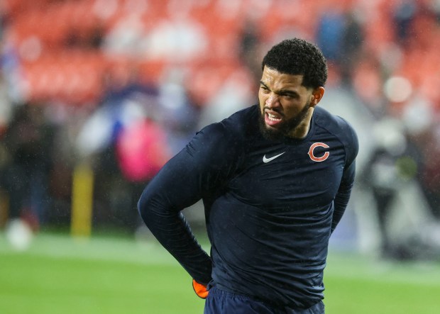 Chicago Bears quarterback Caleb Williams warms up to face the Washington Commanders in the rain Oct. 13, 2025, at Northwest Stadium in Landover, Maryland. (Brian Cassella/Chicago Tribune)