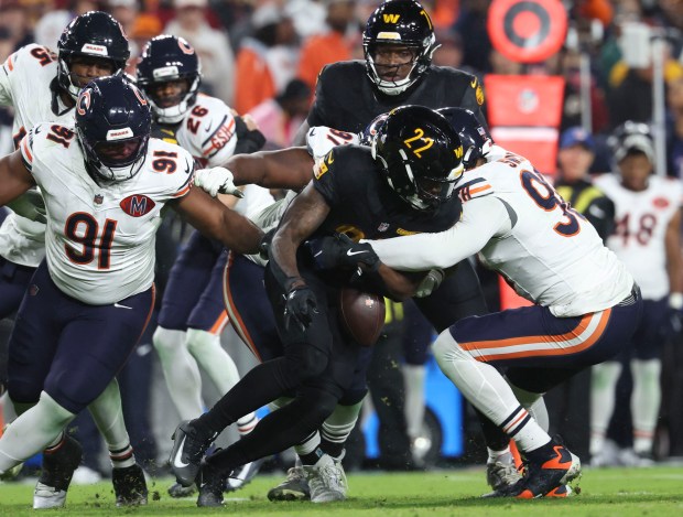 Bears defensive end Montez Sweat (98) forces a fumble by...